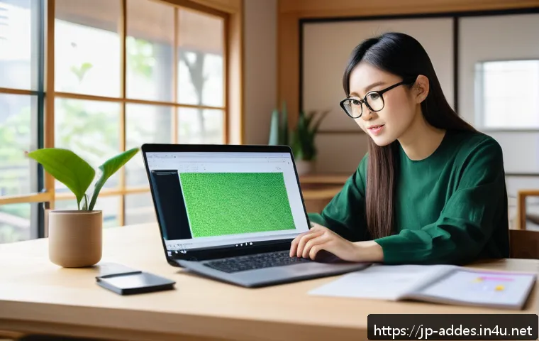 광고디자인 실무 능력 인증 방법 - A modern Japanese workspace featuring a young professional woman studying graphic design on a laptop...